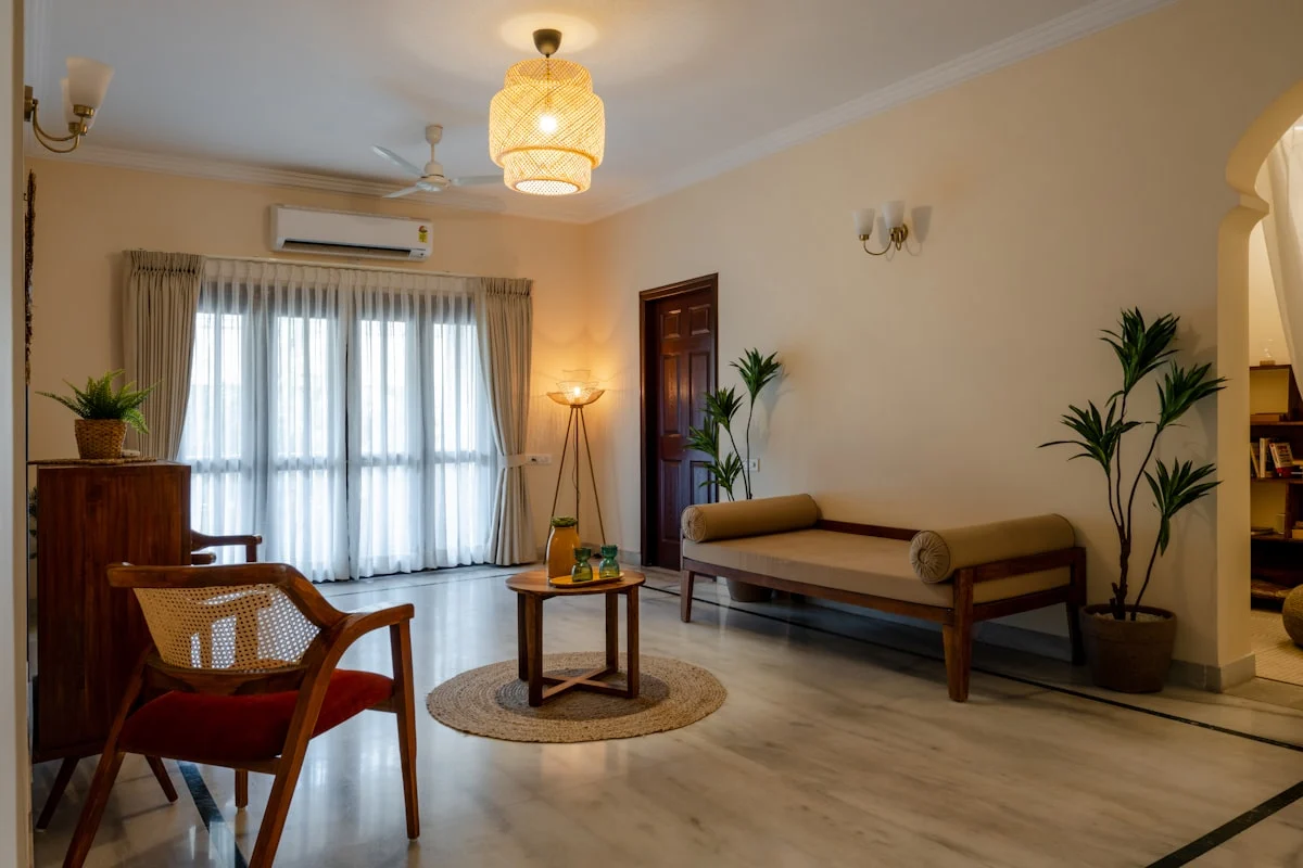 a living room filled with furniture and a window